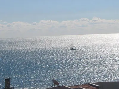 a boat in the middle of the ocean at Lazur Hotel in Ravda