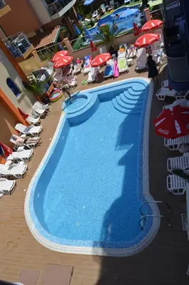 an overhead view of a swimming pool with people and umbrellas at Хотел Калипсо Блу in Primorsko