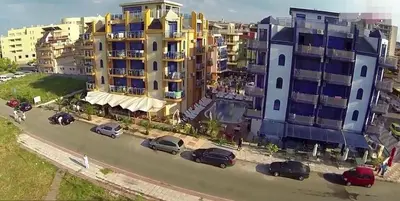 an aerial view of cars parked in a parking lot at Хотел Калипсо Блу in Primorsko