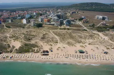 an aerial view of a beach with a city at Хотел Калипсо Блу in Primorsko