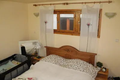 a bedroom with a bed and a window at Paradise Corner in Pomorie