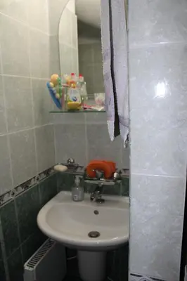 a bathroom with a sink and a mirror at Paradise Corner in Pomorie