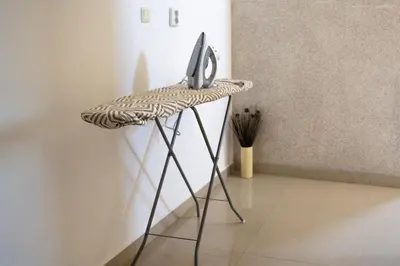 a table with a computer on it in a room at Marianas Guesthouse in Obzor