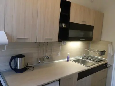 a kitchen with a sink and a counter top at Silver House in Varna City
