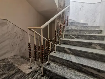 a set of stairs in a building with aitating at Lazur SeaView Apartment in Pomorie