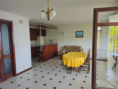 a kitchen with a yellow table in a room at Lazur SeaView Apartment in Pomorie
