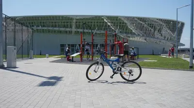 a bike parked in front of a playground at Bright, Comfortable and Cozy Apartment in Burgas City