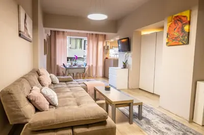 a living room with a couch and a table at City Center apartament “MARTA” in Varna City