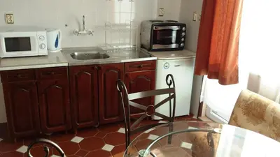a small kitchen with a sink and a microwave at Style Apartment in Pomorie