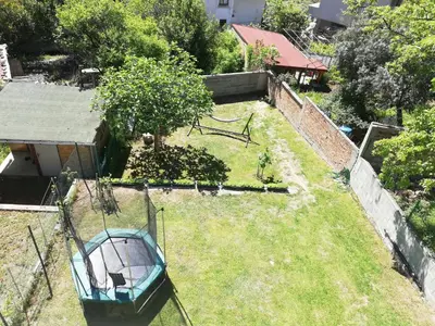 an aerial view of a yard with a boat in the grass at Villa Burkopolis in Sozopol