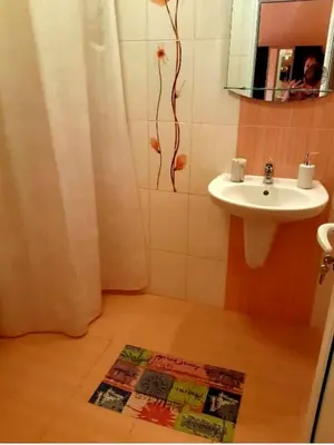 a bathroom with a sink and a mirror and a sink at Къща за гости Вълчеви Несебър in Nesebar
