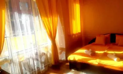 a bedroom with a bed and a window at Къща за гости Вълчеви Несебър in Nesebar