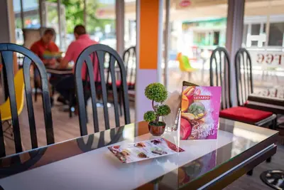 a table with a plant sitting on top of it at Family Hotel Varna in Varna City