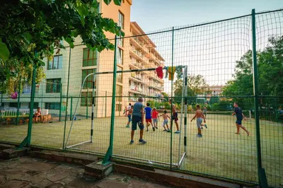 a group of people playing soccer on a court at Perla Plaza Hotel - All Inclusive in Primorsko