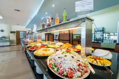 a buffet line with many different types of pizzas at Perla Plaza Hotel - All Inclusive in Primorsko