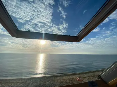a view of the ocean from a window at Hemingway rooms in Happy Beach in Varna City
