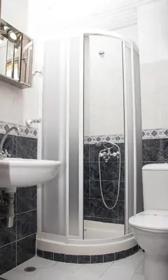a bathroom with a shower and a sink at Apartment Pier in Varna City