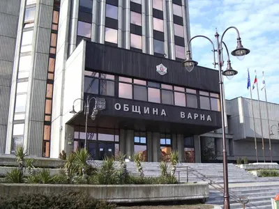 a building with a sign on the front of it at Apartment Pier in Varna City