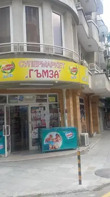 a building with a sign in front of it at Dreamcatcher's home by RV Apartments in Varna City