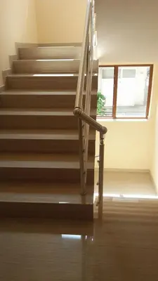 a staircase with a metal hand rail and a window at Aglaya 2 in Pomorie