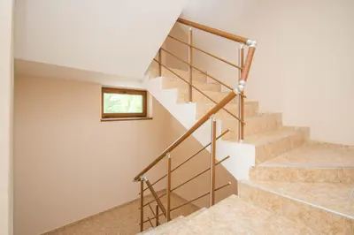 a set of stairs in a house with a window at Villa Tuna in Sveti Vlas
