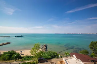 a view of a beach with a boat in the water at Villa Tuna in Sveti Vlas