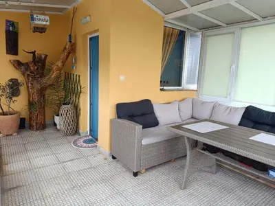 a living room with a couch and a table at Arte Casa in Burgas City