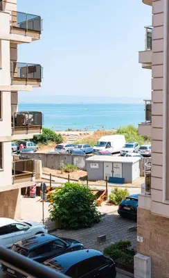 a view of a parking lot with a beach at Lora boutique in Pomorie