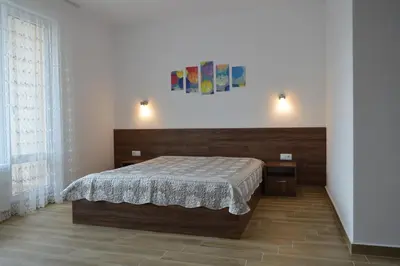 a bedroom with a bed in a room at SummerHouse Lozenets in Lozenets