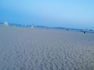 a sandy beach with the ocean in the background at Apartament ,,EDELVAIS- LUX'' in Nesebar