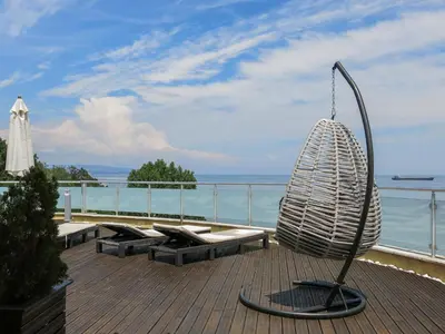 a metal object sitting on top of a deck at Family Hotel Albizia Beach in Varna City