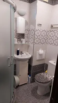 a small bathroom with a toilet and a sink at Apartment Larissa in Pomorie
