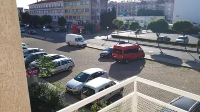 a group of cars parked in a parking lot at Apartment Larissa in Pomorie