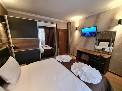 a hotel room with a bed and a mirror at MitProt Panorama Bay 2 luks Apartment ap100 in Sveti Vlas