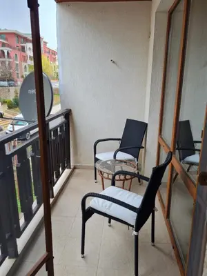 two chairs and a table on a balcony at MitProt Panorama Bay 2 luks Apartment ap100 in Sveti Vlas