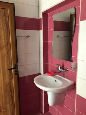 a bathroom with a sink and a mirror at Семейна къща “Вълчеви” in Kiten