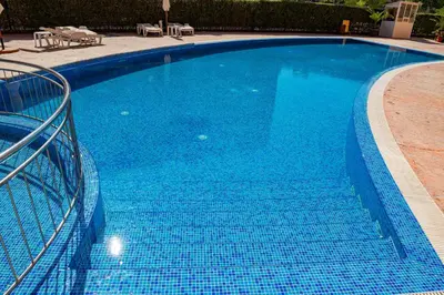 a large blue swimming pool with blue water at Efir 2 - Menada Apartments in Sunny Beach