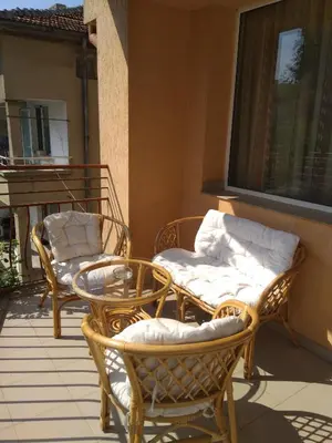 two chairs and a table on a balcony at Laura in Primorsko
