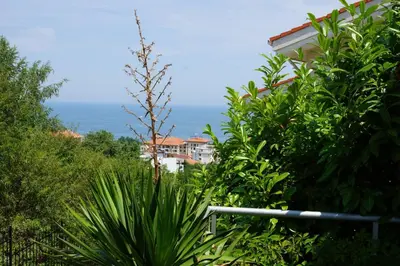 a view of the ocean from the garden of a house at Sun Village Family Houses in Byala