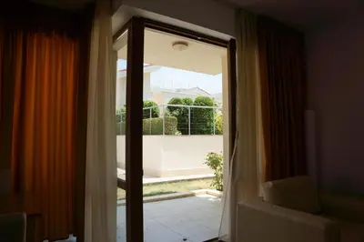 a sliding glass door with a view of a balcony at Sun Village Family Houses in Byala