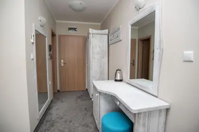 a bathroom with a sink and a mirror at Oasis Del Sol - Front Beach in Lozenets
