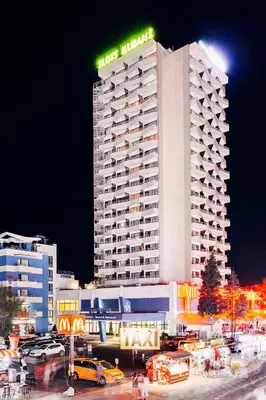 a hotel building with a sign on top of it at Kuban Resort & Aquapark - All Inclusive in Sunny Beach