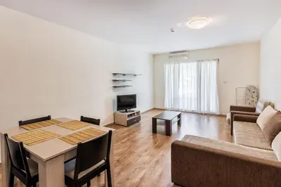 a living room with a table and a couch at Kuban Resort & Aquapark - All Inclusive in Sunny Beach