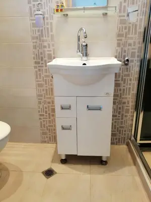 a bathroom with a sink and a toilet at Apartament Peyo Yavorov in Burgas City