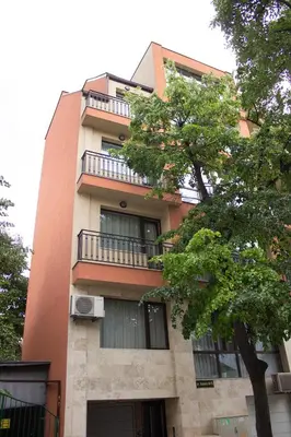 a building with a tree in front of it at Vera by RV Apartments in Varna City