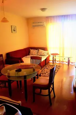 a living room with a couch and a table at Apartment Zora in Sozopol