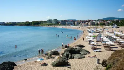a beach with a bunch of people on it at Apartment Lozenets in Lozenets