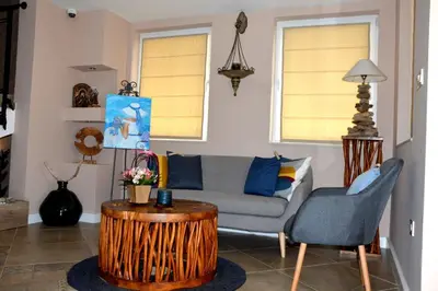 a living room with a couch and a coffee table at Boutique Villa Amalia in Chernomorets