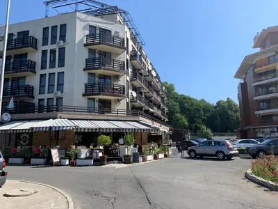 a parking lot in front of a building at Mario Beach Apartment Nessebar in Nesebar