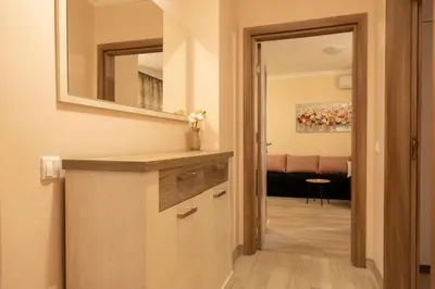 a kitchen with a counter and a mirror in a room at Apartment EliMar in Burgas City